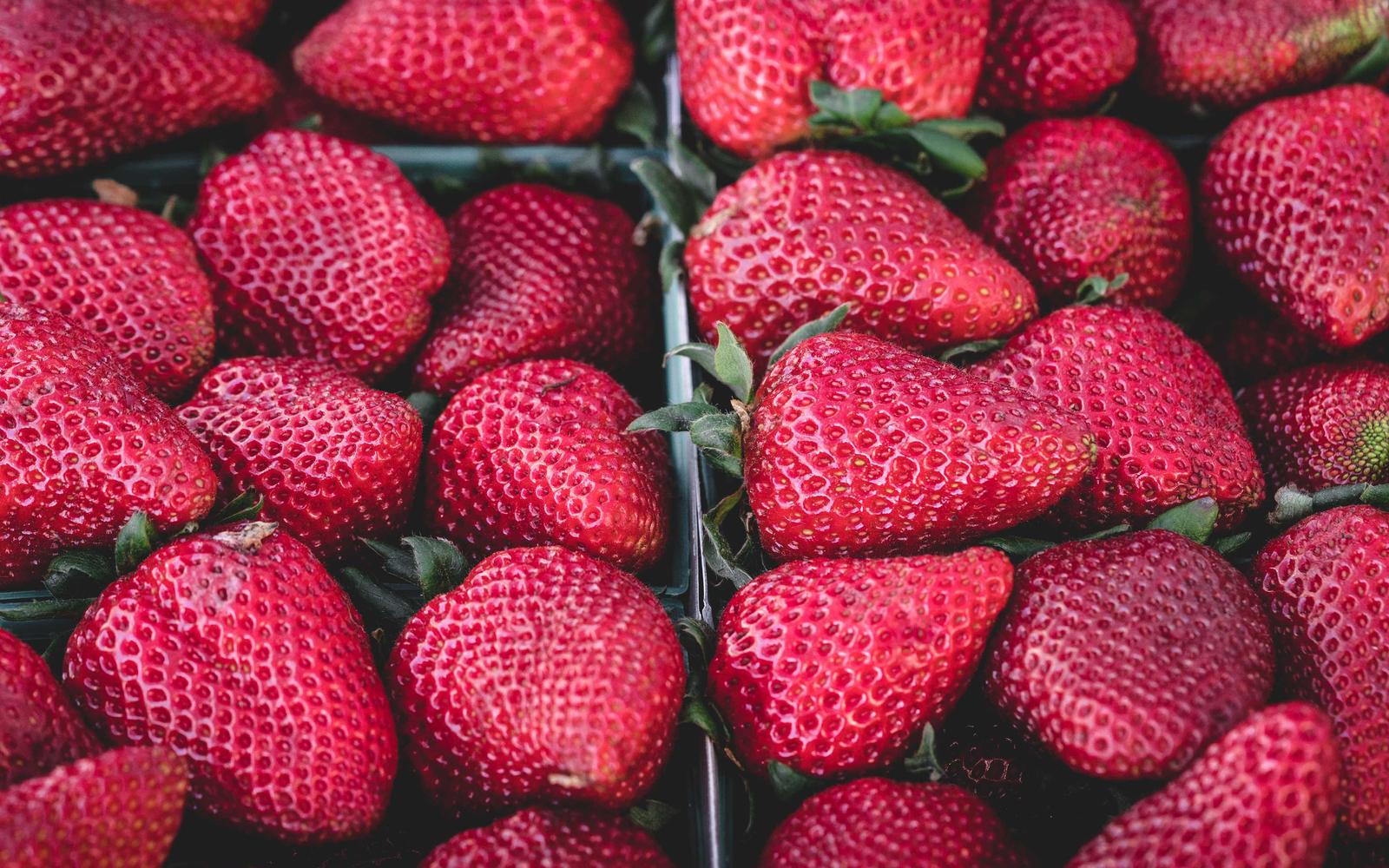Trays of bright red strawberries